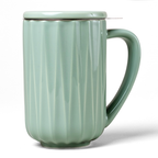 Green Nordic Mug with a textured pattern and matching lid.