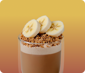 banana bread hojicha  latte with crumble and banana on top