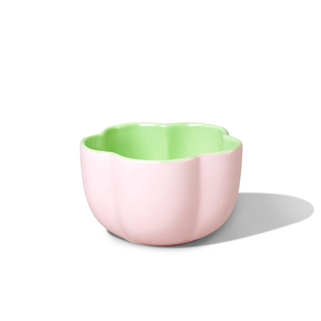 Pink Hana Matcha Bowl with a green interior and scalloped rim.