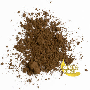dark brown banana flavored hojicha powder on white background